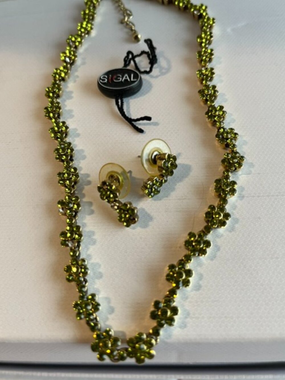 Sigal peridot green stones necklace and matching earrings.